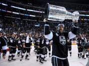 Jun 13, 2014; Los Angeles, CA, USA; Los Angeles Kings right wing Justin Williams hoists the Stanley Cup after defeating the New York Rangers game five of the 2014 Stanley Cup Final at Staples Center. Mandatory Credit: Gary A. Vasquez-USA TODAY Sports