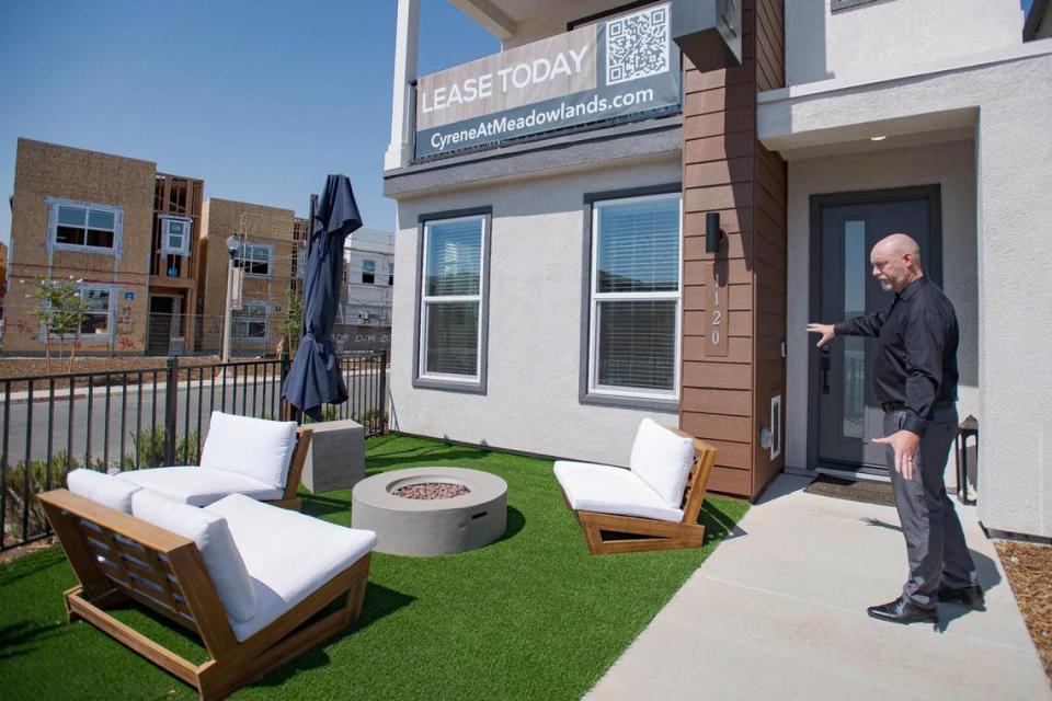 Community manager Trevor Bane tours the front yard of a home at the single-family rental home community Cyrene at Meadowlands on Wednesday, July 19, 2023, in Lincoln.