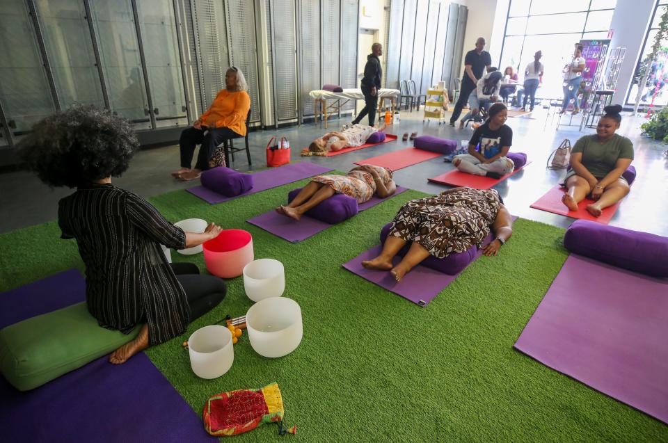 Healing arts practitioner, Adriena Dame, host a meditative yoga experience during the immersive Breonna Taylor event on Sunday, June 5, 2022