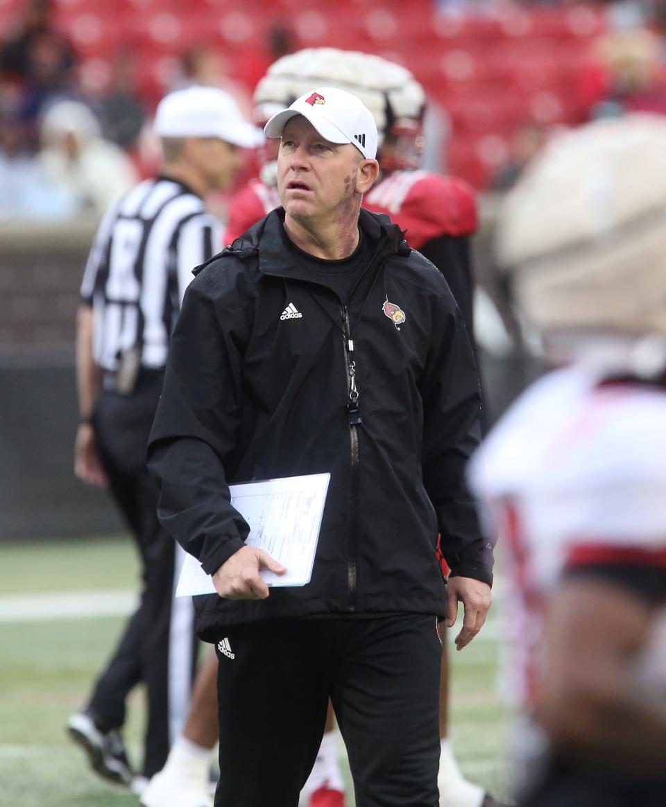 Louisville’s coach Jeff Brohm walked around before the game against Louisville’s defense.  April 21, 2023