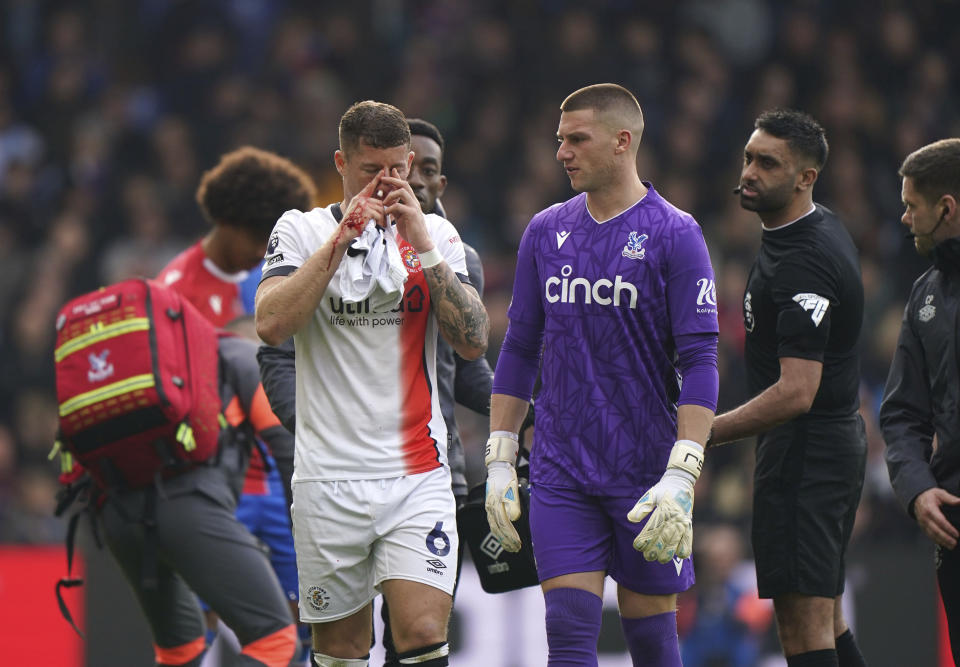 Luton Town's Ross Barkley receives treatment for a bloody nose, during the English Premier League soccer match between Crystal Palace and Luton Town, at Selhurst Park, in London, Saturday March 9, 2024. (Bradley Collyer/PA via AP)