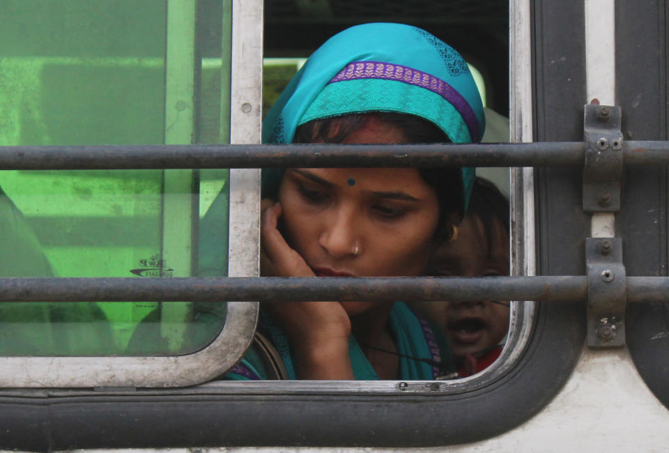 GURUGRAM, INDIA - MAY 13: Migrants at Govt Girls College Sector 14 heading by bus to board a Shramik Special train to Madhya Pradesh, on May 13, 2020 in Gurugram, India. (Photo by Yogendra Kumar/Hindustan Times via Getty Images)