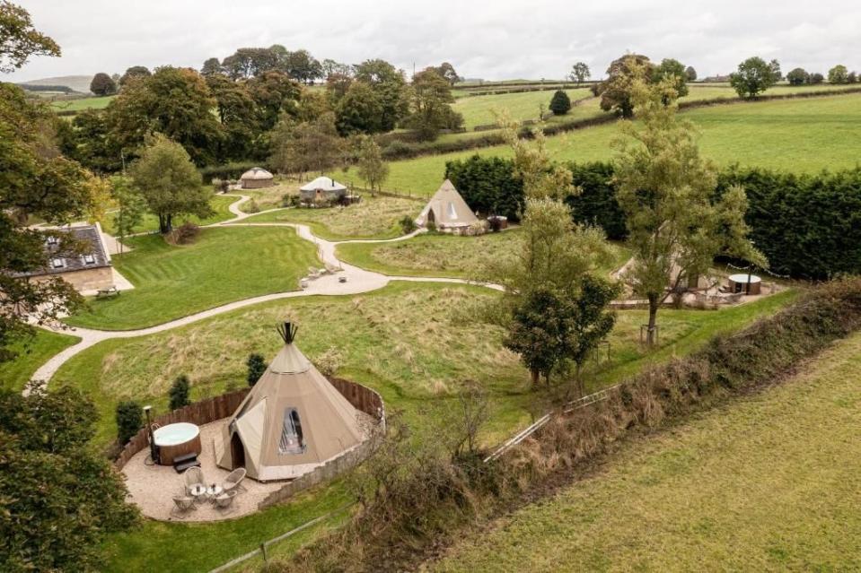 <p>Less than 25 minutes north of Alton Towers in a plum spot in the Peak District National Park, this boutique glamping site is a calm retreat from the theme park, with gorgeous footpaths right from its gate and an array of pubs, village shops and a farm shop all within walking distance. </p><p><a href="https://www.booking.com/hotel/gb/scaldersitch-farm-boutique-camping-tipis-and-yurt.en-gb.html?aid=2070936&label=places-to-stay-near-alton-towers" rel="nofollow noopener" target="_blank" data-ylk="slk:Scaldersitch Farm;elm:context_link;itc:0;sec:content-canvas" class="link ">Scaldersitch Farm</a>'s four pretty tipis with their fairylights and lanterns sleep up to five and have rustic wooden furnishings, faux fur throws, sheepskin rugs, wood-burning stoves and wood-fired hot tubs for the full-on cosy effect, plus those all-important coffee makers.</p><p><a class="link " href="https://www.booking.com/hotel/gb/scaldersitch-farm-boutique-camping-tipis-and-yurt.en-gb.html?aid=2070936&label=places-to-stay-near-alton-towers" rel="nofollow noopener" target="_blank" data-ylk="slk:BOOK A STAY;elm:context_link;itc:0;sec:content-canvas">BOOK A STAY</a></p>