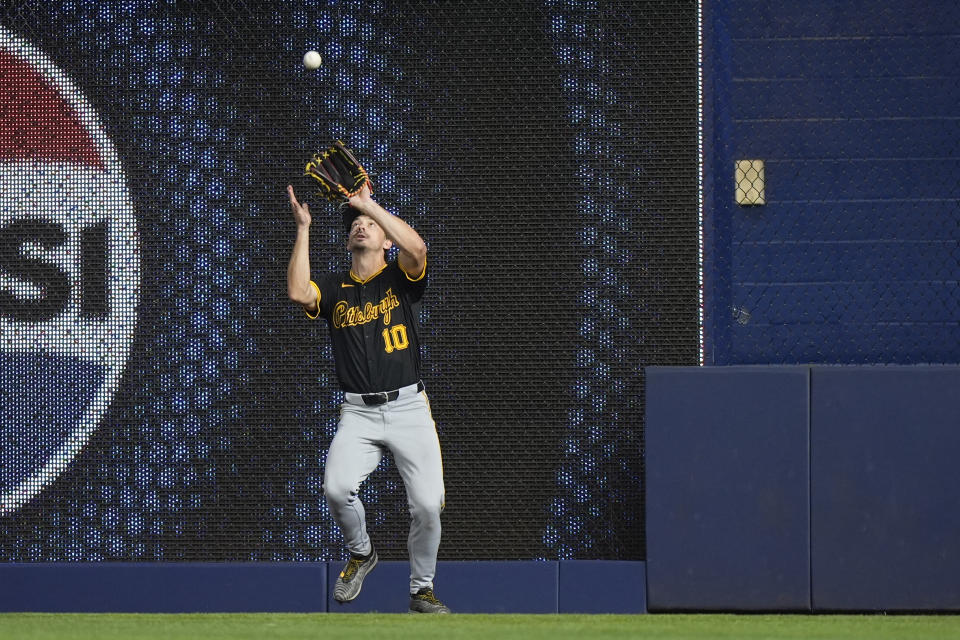 Pittsburgh Pirates right fielder Bryan Reynolds catches a ball hit by Miami Marlins' Bryan De La Cruz to end the 12th inning of a baseball game, Thursday, March 28, 2024, in Miami. The Pirates beat the Marlins 6-5 in 12 innings. (AP Photo/Wilfredo Lee)