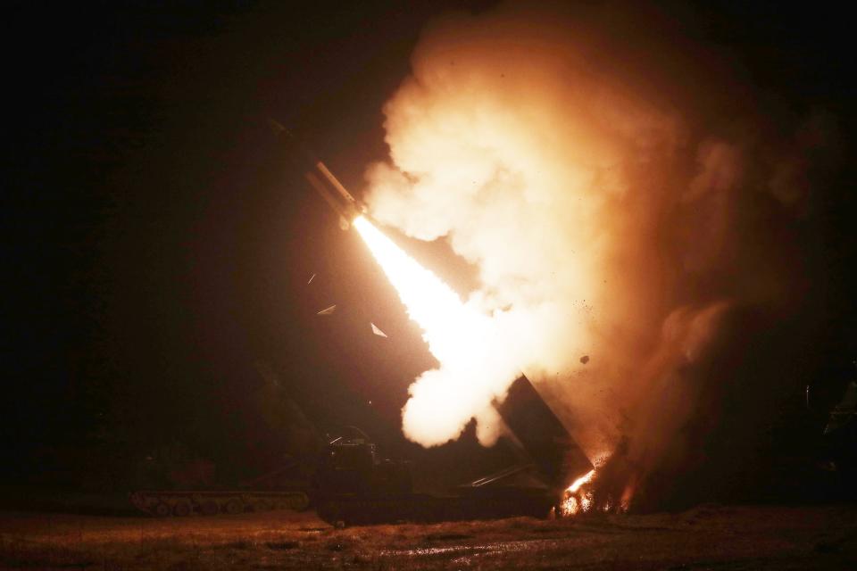 An ATACMS missile being fired at night