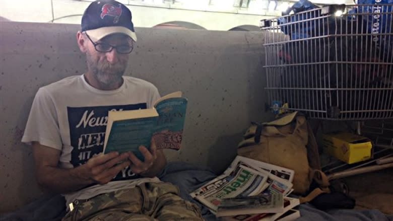 With no fixed address, two men start Toronto's only underpass library