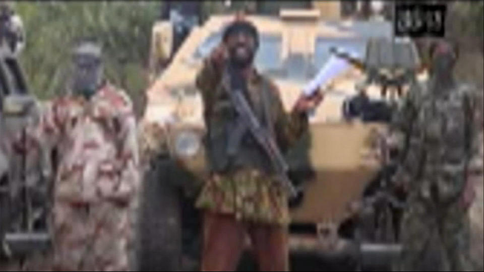 In this image made from video received by The Associated Press on Monday, May 5, 2014, Abubakar Shekau, the leader of Nigeria's Islamic extremist group Boko Haram, speaks in a video in which his group claimed responsibility for the April 15 mass abduction of nearly 300 teenage schoolgirls in northeast Nigeria. Shekau threatened to sell the nearly 300 teenage schoolgirls abducted from a school in the remote northeast three weeks ago, in a new videotape received Monday. It was unclear if the video was made before or after reports emerged last week that some of the girls have been forced to marry their abductors — who paid a nominal bride price of $12 — and that others have been carried into neighboring Cameroon and Chad. Those reports could not be verified. (AP Photo)