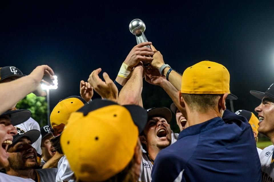 Grand Ledge celebrates with the trophy after beating DeWitt to win the Diamond Classic on Monday, June 7, 2021, at Kircher Municipal Park in Lansing.