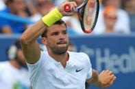 Aug 20, 2017; Mason, OH, USA; Grigor Dimitrov (BUL) returns a shot against Nick Kyrgios (AUS) in the finals during the Western and Southern Open at the Lindner Family Tennis Center. Mandatory Credit: Aaron Doster-USA TODAY Sports