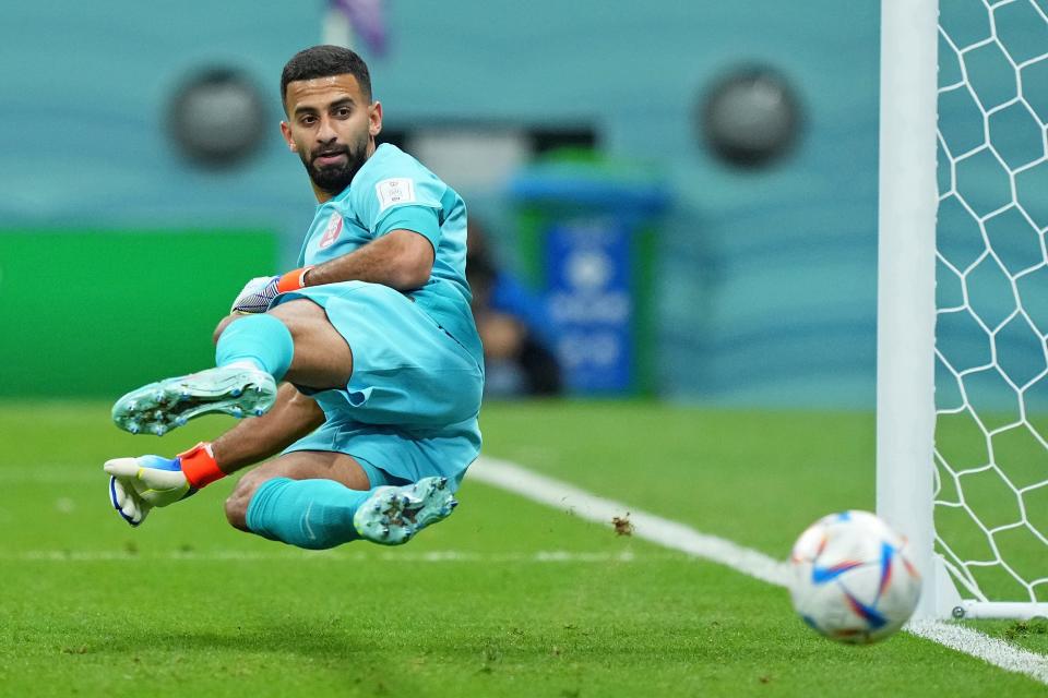 Qatar goalkeeper Saad Al-Sheeb (1) is unable to make a save on a penalty kick taken by Ecuador forward Enner Valencia (not pictured) during the first half during a group stage match during the 2022 FIFA World Cup at Al Bayt Stadium.