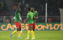 Cameroon's Vincent Aboubakar, left, celebrates scoring his side's second goal during the African Cup of Nations 2022 round of 16 soccer match between Cameroon and Comoros at the Olembe stadium in Yaounde, Cameroon, Monday, Jan. 24, 2022. (AP Photo/Themba Hadebe)