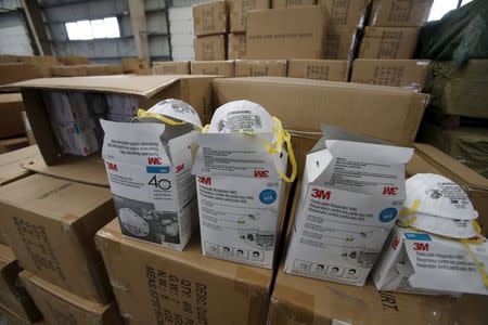 Fake masks are displayed on boxes after being seized by customs in Shanghai, China, December 8, 2015. REUTERS/Stringer