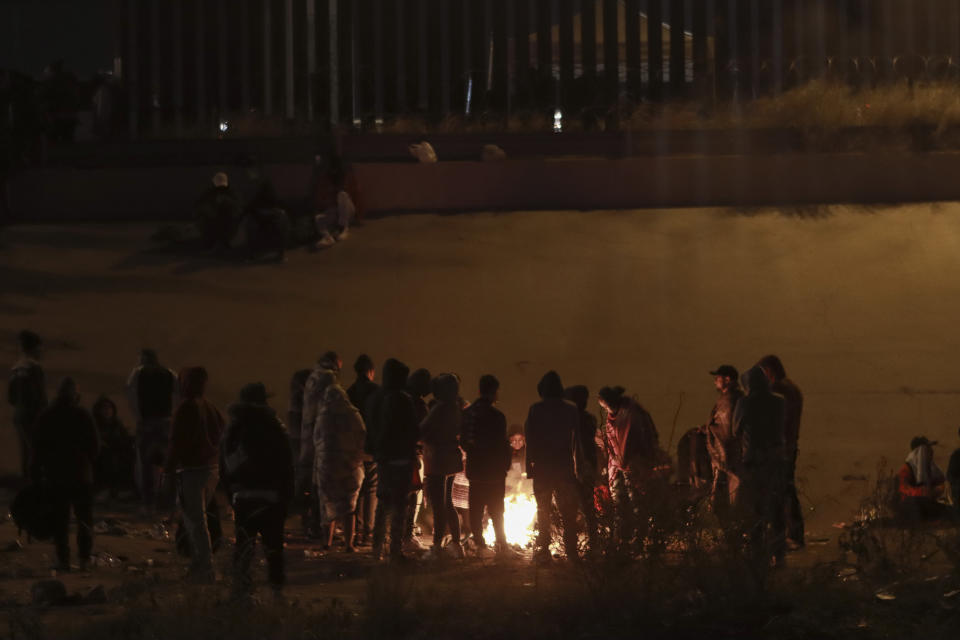 Migrants wait near the U.S.-Mexico border in Ciudad Juarez, Mexico, Monday, Dec. 19, 2022. Pandemic-era immigration restrictions in the U.S. known as Title 42 are set to expire on Dec. 21. (AP Photo/Christian Chavez)