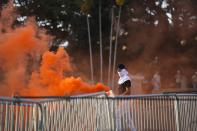 A demonstrator protests against a recently approved mining contract between the government and Canadian mining company First Quantum, outside the National Assembly in Panama City, Monday, Oct. 23, 2023. (AP Photo/Arnulfo Franco)