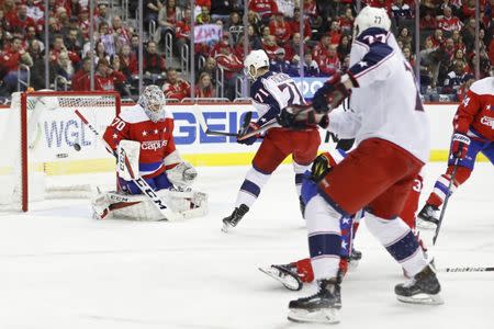 Jan 12, 2019; Washington, DC, USA; Washington Capitals goaltender Braden Holtby (70) makes a save on Columbus Blue Jackets right wing Josh Anderson (77) in the second period at Capital One Arena. Mandatory Credit: Geoff Burke-USA TODAY Sports