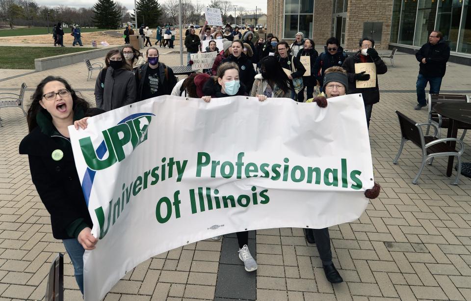 Some University of Illinois faculty and students participate in a March 31 rally on campus held by the UIS teacher's union for a new contract. [Thomas J. Turney/ The State Journal-Register]