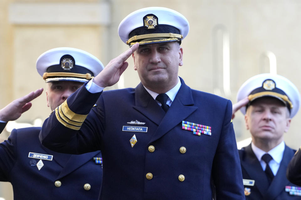 Vice Admiral Oleksii Neizhpapa of Ukraine salutes as he arrives for a meeting with Britain's Defence Secretary Grant Shapps and Norway's Minister of Defence Bjorn Arild Gram, in London, Monday, Dec. 11, 2023. Britain's Ministry of Defense is transferring two minehunting ships to Ukraine as part of a package of long-term support to bolster security in the Black Sea. The transfer comes as Britain and Norway announce plans for a new maritime coalition to increase support for Ukraine in the war with Russia. (AP Photo/Kirsty Wigglesworth)