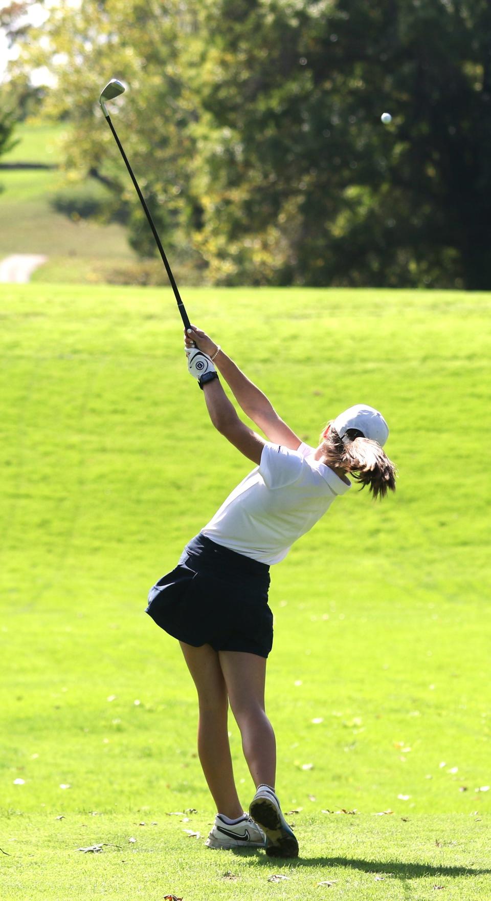 Garaway's Kylie Miller drives off the 17th hole during Wednesday's Division II girls district tournament at Cambridge Country Club.