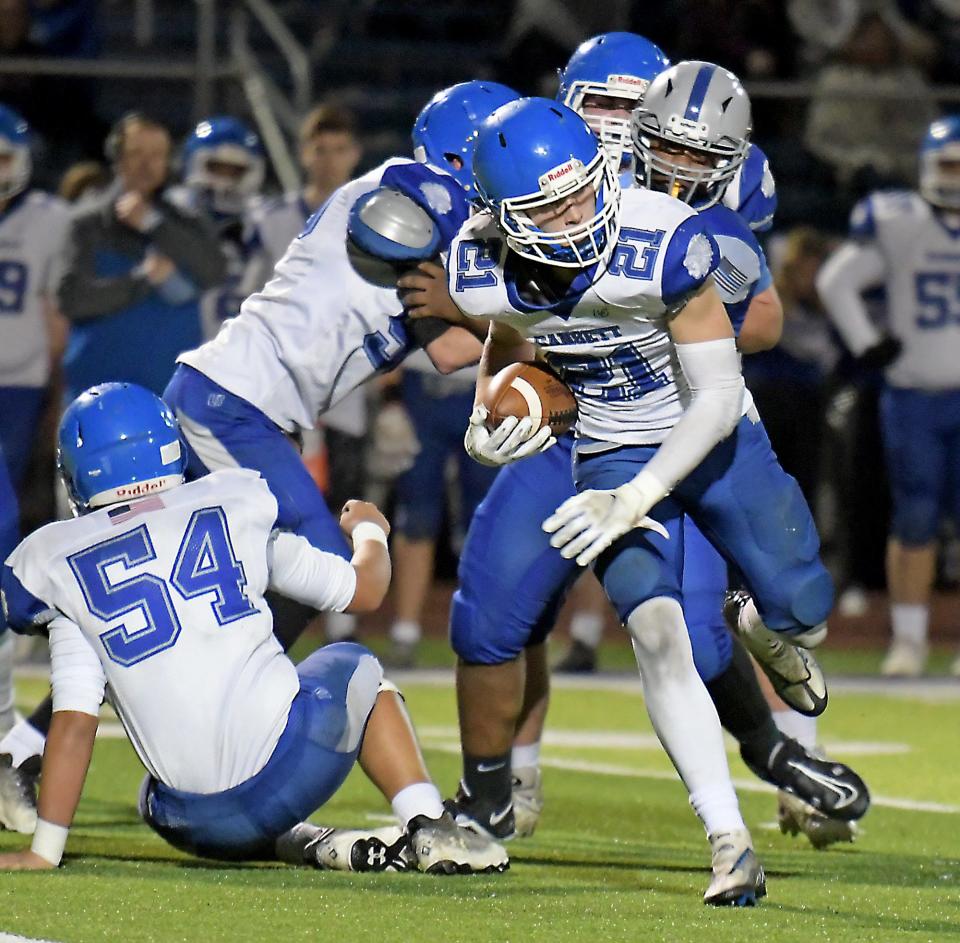 Narragansett's Cam Hoey finds a hole in the Auburn line during a game last October.