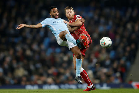 Soccer Football - Carabao Cup Semi Final First Leg - Manchester City vs Bristol City - Etihad Stadium, Manchester, Britain - January 9, 2018 Manchester City's Raheem Sterling in action with Bristol City's Nathan Baker Action Images via Reuters/Carl Recine