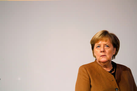 German Chancellor Angela Merkel tours Christian Democratic Union (CDU) party congress venue in Hamburg, Germany, December 6, 2018. REUTERS/Kai Pfaffenbach