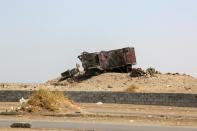 A destroyed vehicle in the Yemeni port city of Hodeidah on October 13, 2016