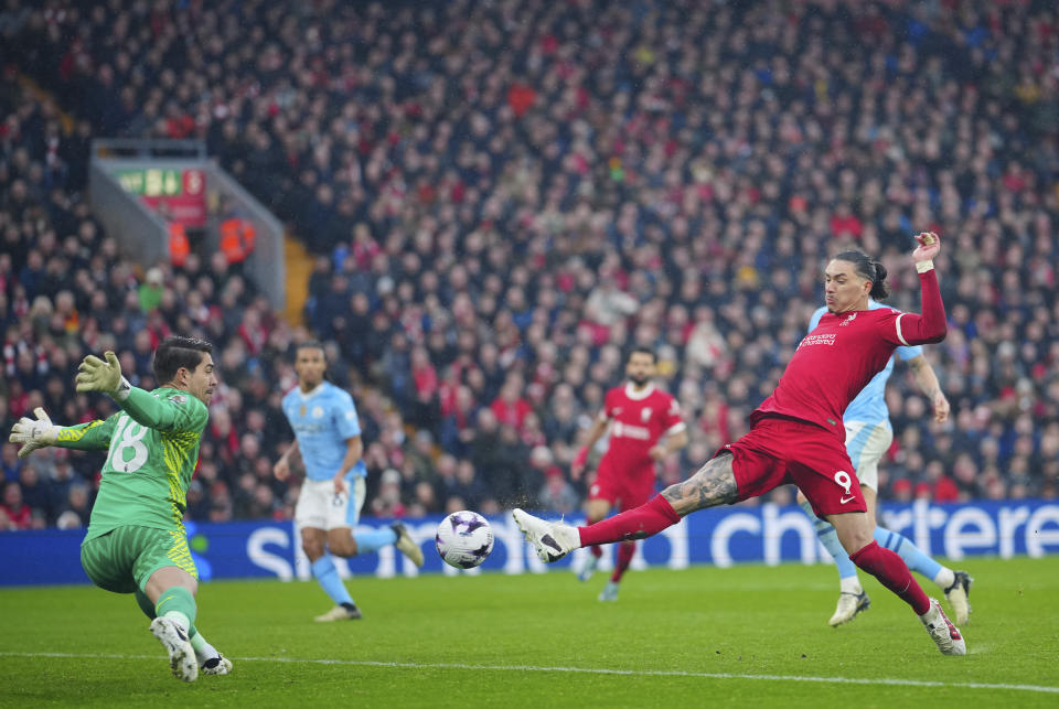 FILE - Liverpool's Darwin Nunez, right, makes an attempt to score against Manchester City's goalkeeper Stefan Ortega during the English Premier League soccer match between Liverpool and Manchester City, at Anfield stadium in Liverpool, England, on March 10, 2024. A fourth-straight Premier League title for Manchester City marks an unprecedented period of dominance by one team in English soccer. (AP Photo/Jon Super, File)
