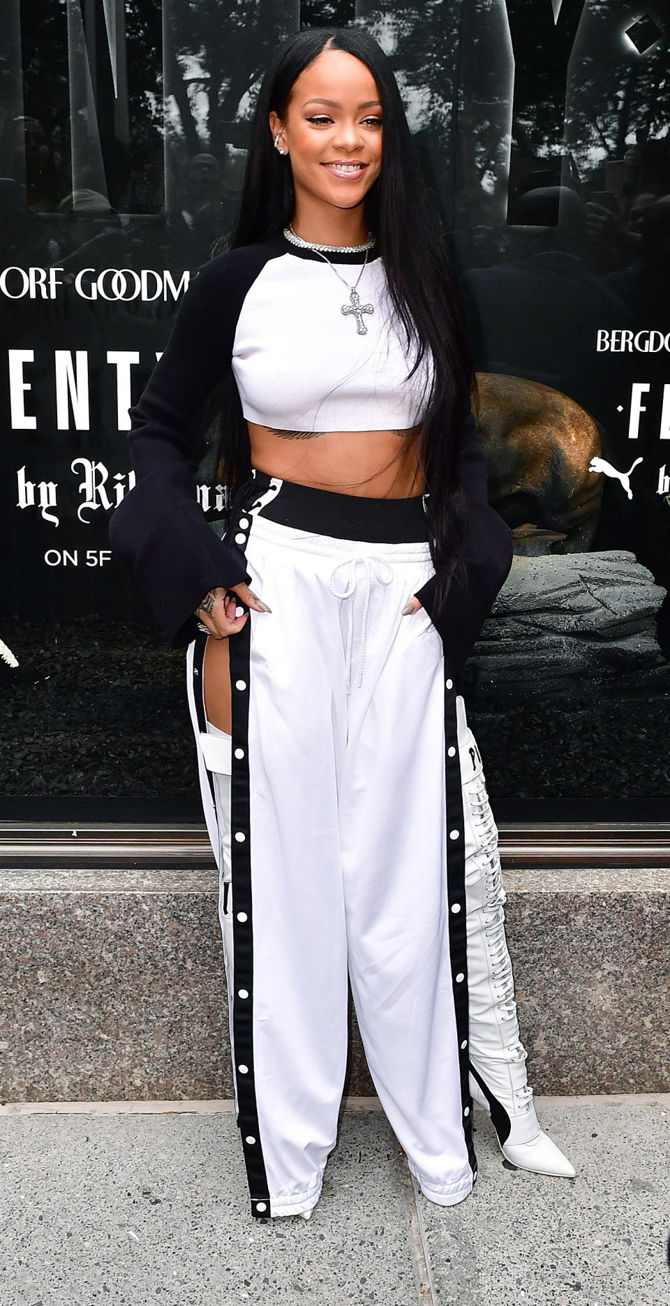 <p>Thigh-high lace-up boots aside, this just might be the most accessible outfit Rihanna has worn in a while. Why? Many of us likely have all of these pieces-including the sweats- left over from our high school wardrobes.</p>