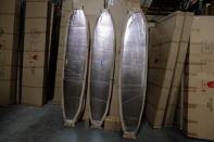 Doyle surfboards manufactured in China are shown in a warehouse in Lake Forest, California