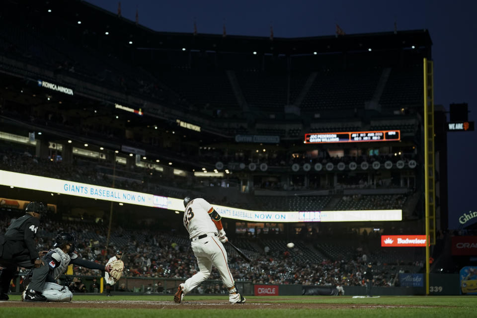 San Francisco Giants' Joc Pederson (23) hits an RBI single against the Cleveland Guardians during the third inning of a baseball game Monday, Sept. 11, 2023, in San Francisco. (AP Photo/Godofredo A. Vásquez)