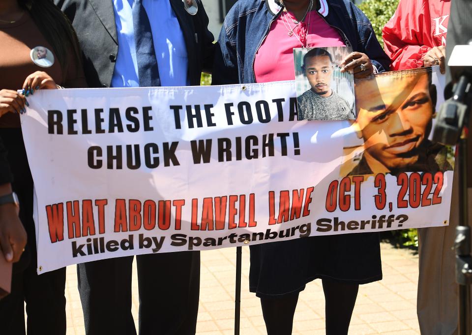 The parents of Lavell Lane, Andy Reese and Beverly Reese Lane filed civil charges against Spartanburg County and the Spartanburg County Sheriff's Office on April 17, 2023.  Lavell Lane died in custody at the Spartanburg County Detention Center. Andy Reese and Beverly Reese Lane, left, hold a banner asking that the footage at the detention center of their son be released.