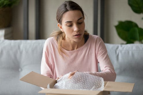 <span class="caption">A large proportion of at-home fertility tests are aimed at women.</span> <span class="attribution"><a class="link " href="https://www.shutterstock.com/image-photo/concentrated-young-mixed-race-woman-unpacking-1477334057" rel="nofollow noopener" target="_blank" data-ylk="slk:fizkes/ Shutterstock;elm:context_link;itc:0;sec:content-canvas">fizkes/ Shutterstock</a></span>