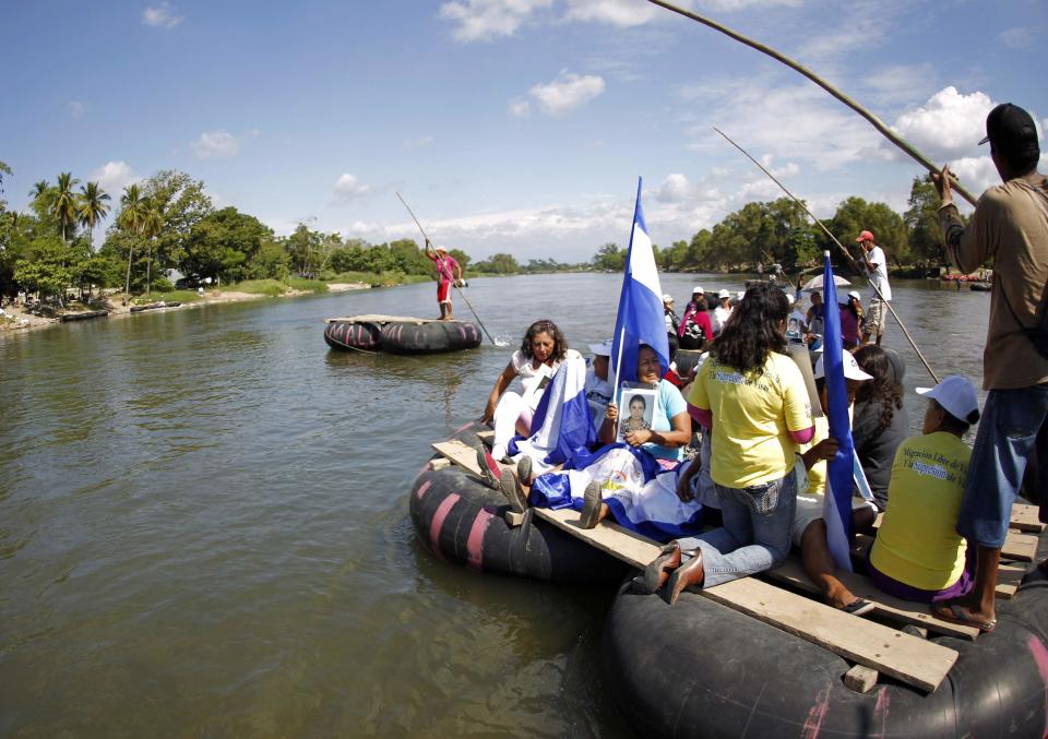 Women from "Caravana de Madres Centroamericanas" ride a raft as they cross to Guatemala from borders of Ciudad Hidalgo