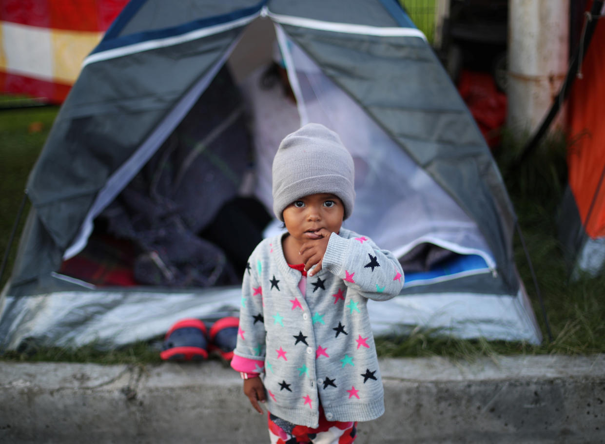 A migrant child, part of a caravan headed to the U.S., at a makeshift camp in Mexico City in November. (Photo: Hannah McKay/Reuters)