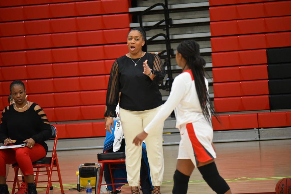 West Florida High girls basketball coach Ieasha Stallworth-Ridgeway instructs her daughter, senior guard Amari Franklin during the Feb. 17  Region 1-4A semifinal against Marianna.