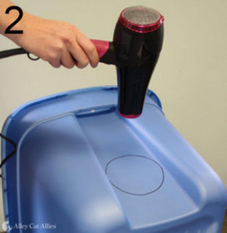 During a class on how to build a shelter for feral cats using a storage tote, Avery Gunther, outreach coordinator for SAFE Haven for Cats, said a hair dryer can be used to warm the plastic for easier cutting. SAFE Haven for Cats