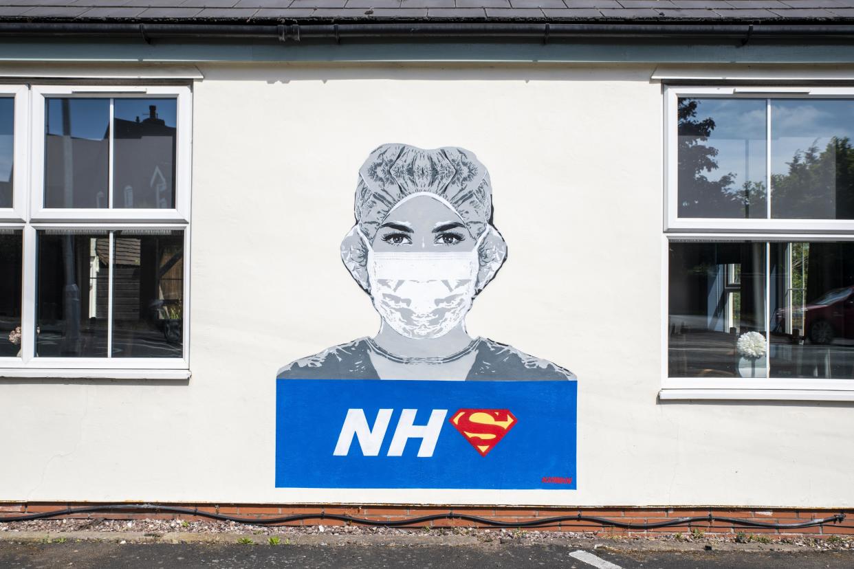 A piece of street art of a nurse in honour of NHS staff during the coronavirus pandemic, recently painted by street artist John D�oh, on a wall of The Bull Inn in Fernhill Heath, Worcestershire.