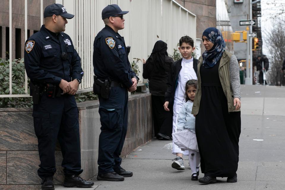 Worshippers arrive for service at the Islamic Cultural Center of New York under increased police security following the shooting in New Zealand, Friday, March 15, 2019, in New York.