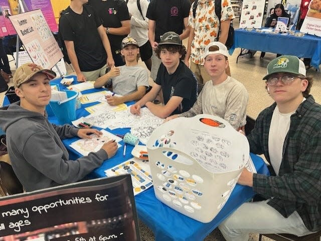 Students Cody Sype, Tyler Sype, Alex Ogonowski, Tim Salter and Brock Souva created summer bucket lists at the recent Airport High School Health and Wealth Expo.