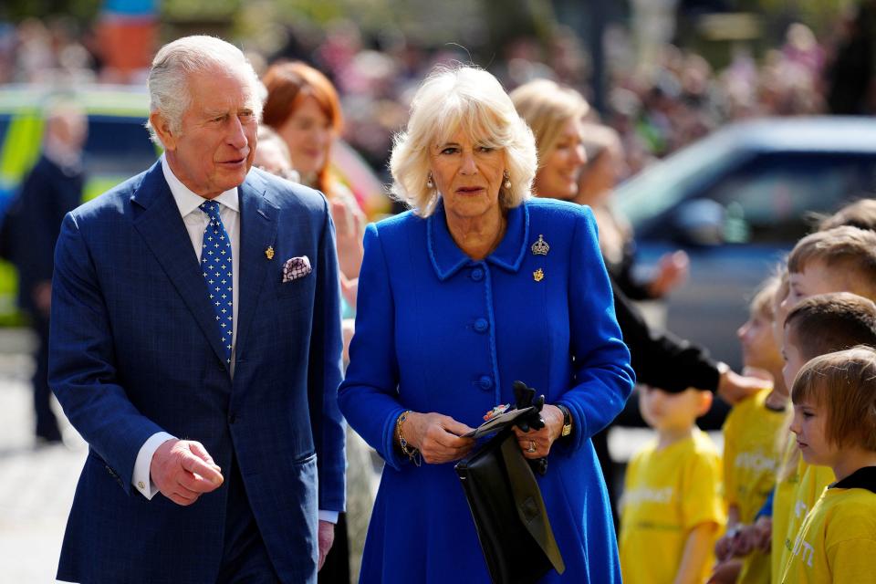 Britain's Camilla, Queen Consort (R) and Britain's King Charles III (L) arrive to visit the Liverpool Central Library on April 26, 2023 to officially mark the Library's twinning with Ukraine's first public Library, the Regional Scientific Library in Odessa. (Photo by Jon Super / POOL / AFP) (Photo by JON SUPER/POOL/AFP via Getty Images)