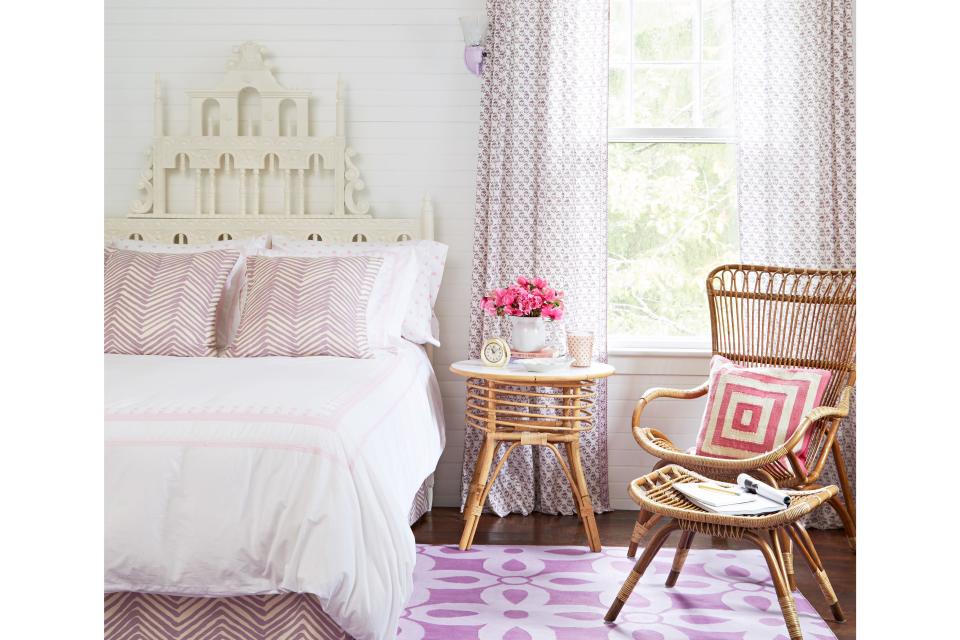 <p>Curtains and a rug in cheery lavender honor the burgeoning tastes of a purple-loving child, while a Victorian-inspired headboard is an architectural detail that will grow up alongside her.</p>