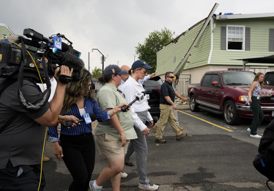 FEMA Administrator Deanne Criswell, center, visits an apartment complex damaged by severe storms at Spring Branch in Houston, Tuesday, May 21, 2024. (Yi-Chin Lee/Houston Chronicle via AP)