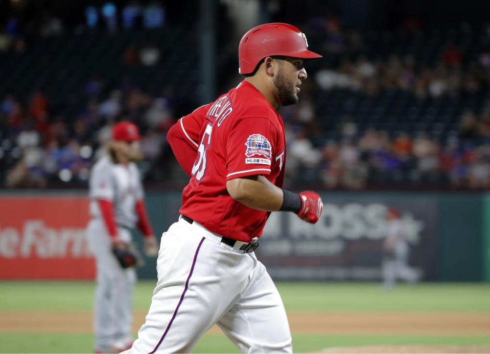 CORRECTS ID TO JOSE TREVINO INSTEAD OF KOLE CALHOUN - Los Angeles Angels' Jose Trevino jogs home after hitting a solo home run in the fourth inning of baseball game against the Los Angeles Angels in Arlington, Texas, Monday, Aug. 19, 2019. The shot was the first homer of Trevino's career. (AP Photo/Tony Gutierrez)