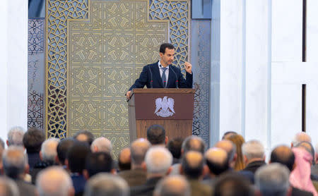 Syria's President Bashar al-Assad speaks during a meeting with heads of local councils, in Damascus, Syria in this handout released by SANA on February 17, 2019. SANA/Handout via REUTERS