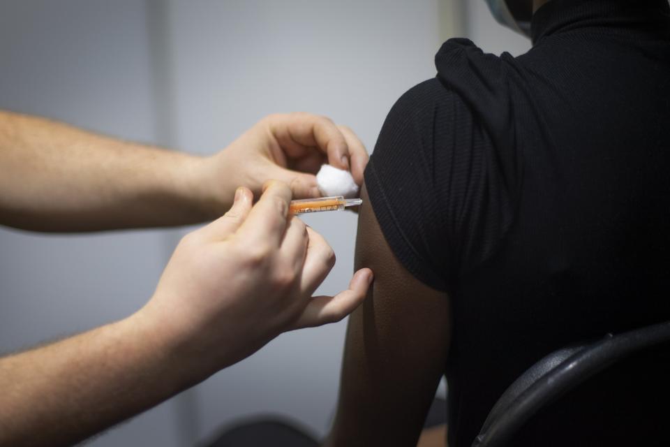 Person receives vaccine (PA Wire)