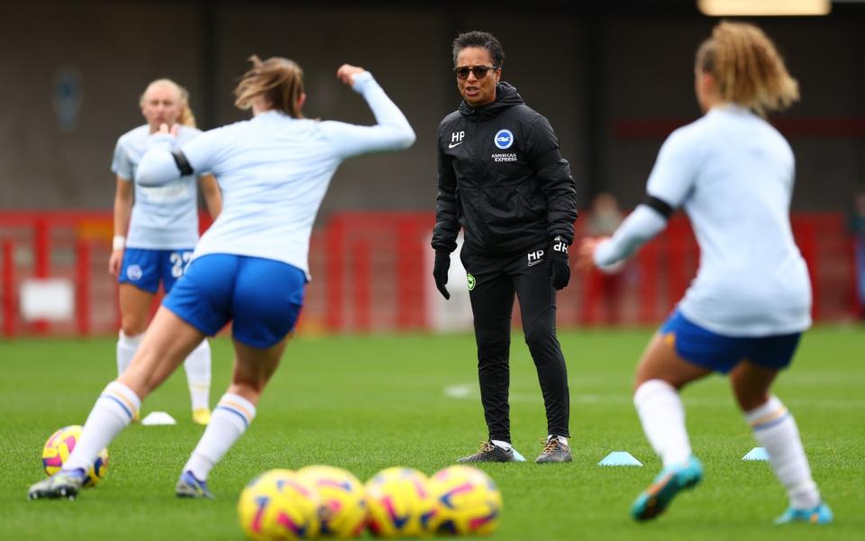 Hope Powell, Manager of Brighton & Hove Albion interacts with players during warm ups prior to the FA Women's Super League match between Brighton & Hove Albion and Tottenham Hotspur at Broadfield Stadium - England’s win led to a flood of interest, but below the elite level, the game is battling - Bryn Lennon/Getty Images