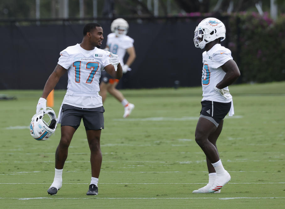 Miami Dolphins tight end Keith Jackson, sits dejected on the bench