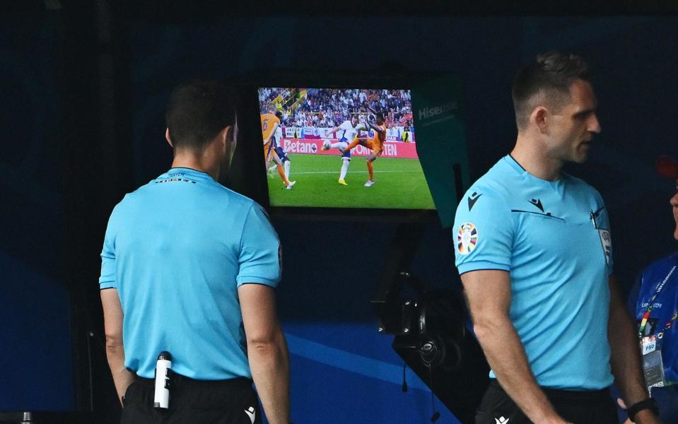 Referee Felix Zwayer checks the Video Assistant Referee screen and England are awarded a penalty following the review, after Denzel Dumfries of the Netherlands (not pictured) is adjudged to have fouled Harry Kane of England (not pictured), during the UEFA EURO 2024 semi-final match between Netherlands and England at Football Stadium Dortmund on July 10, 2024 in Dortmund, Germany