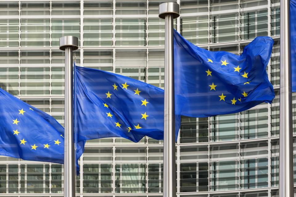 Brussels, Belgium, European flags flying in front of the Berlymont building, the head offices of the European Commission.