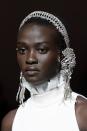 <p>If extravagant face adornments aren't your thing, glowing skin paired with a glittering hairband does the trick. </p>